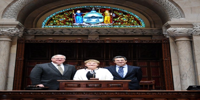 “Kathryn Boor has earned and deserves this recognition. She exemplifies everything that the Senate’s ‘Woman of Distinction’ tribute honors in public service," said Senator O'Mara. In the above photo on the rostrum in the Senate Chamber, from left to right: Senator O'Mara, Dean Kathryn Boor and her husband, Martin.