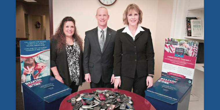 Susan Rowley, President, Lake Erie Chapter of the Blue Star Mothers of New York; Kevin Hanna, Director of External Affairs, AT&T; and Senator Young with a sample of the mobile devices that were collected through the cell phone drive.