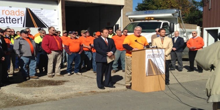 Senator O'Mara speaks at today's news conference in Corning with Assemblyman Palmesano (l.), Assemblyman Friend (r.) and local highway superintendents and other officials.