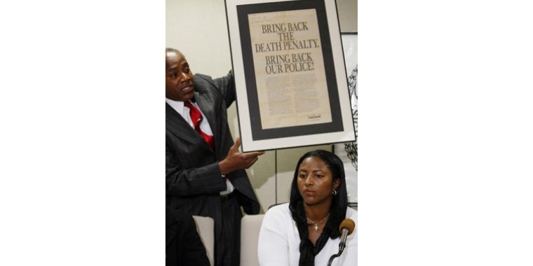 Senator Bill Perkins holds up an ad taken out by Donald Trump after the crime.