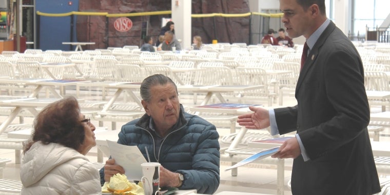 Senator Carlucci greets shoppers at the Palisades Mall and gives them information about new gift card laws