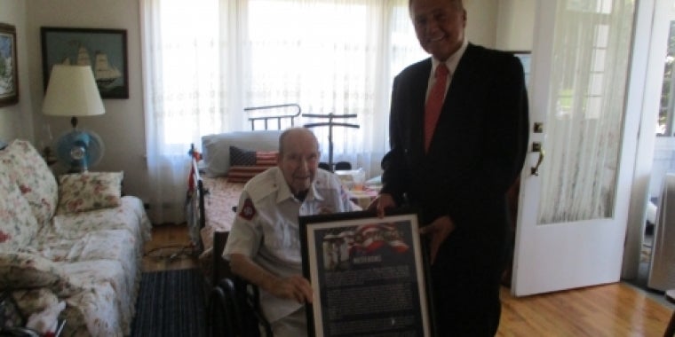 Senator Bonacic presents Walter E. Hughes with a ceremonial plaque from the 2016 NY Senate Veterans Hall of Fame Ceremony.