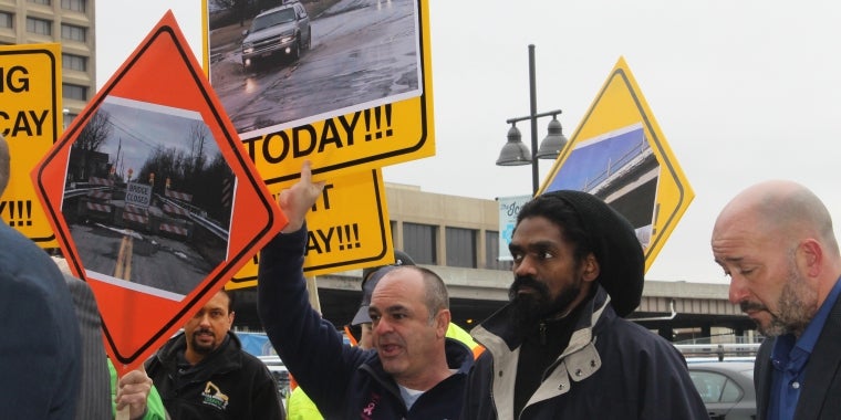 Members of the State Legislature stand alongside leading transportation and construction experts and community members to call for infrastructure parity