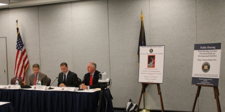 Senator Ranzenhofer sits on a panel during a public hearing on the future of sheltered workshops.