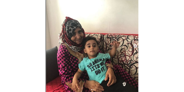 Shamsan Al Lahabi and her grandson at her new home in Bay Ridge, Brooklyn