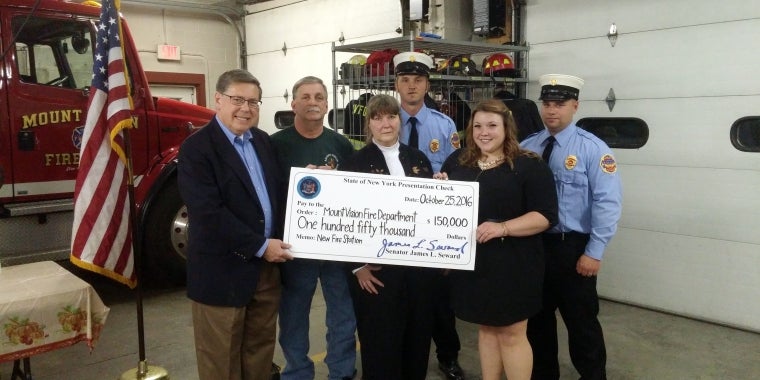 From left, Senator Seward, Les Burgess, Betty Burgess (Adam Burgess's parents), Second Assistant Chief Andrew Parker, Jennifer Dubina (Adam Burgess's fiancé), Chief Jimmy Cox.