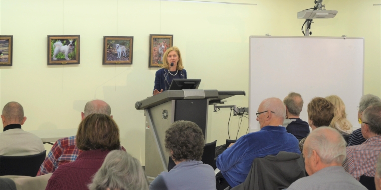 Senator Phillips is pictured discussing some of the recent scams criminals are using to steal from the elderly with seniors at the senior scam prevention program she sponsored in Albertson.