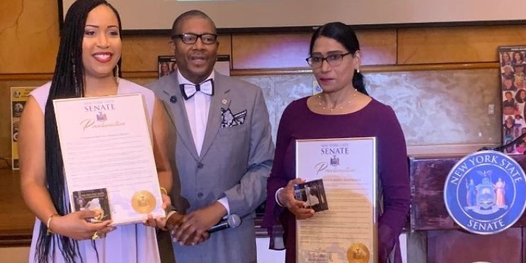 Senator Sanders presents awards to two of the top honorees Phara Carolei, left, and Radica Rampersaud. The remaining top honoree, Jennifer A. Henry was not in attendance. Her awards will be mailed to her.