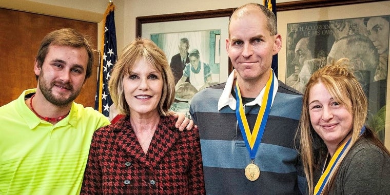 Senator Young honored Tom and Becky Simsick for their heroic rescue of Joshua Lightner.  Left to right: Joshua Lightner, Senator Young, Tom Simsick & Becky Simsick.