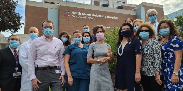 Caption: (L-R) Rabbi Hillel Fox, North Shore University Hospital (NSUH) Chief Medical Officer Dr. Michael Gitman, NSUH Executive Director Jon Sendach, NSUH Nurses, NSUH CFO Ryan Andersen, Rabbi Tara Feldman, Senator Anna M. Kaplan, NSUH Hospital Leadership team pose in front of North Shore University Hospital in Manhasset before the Shofar Blast