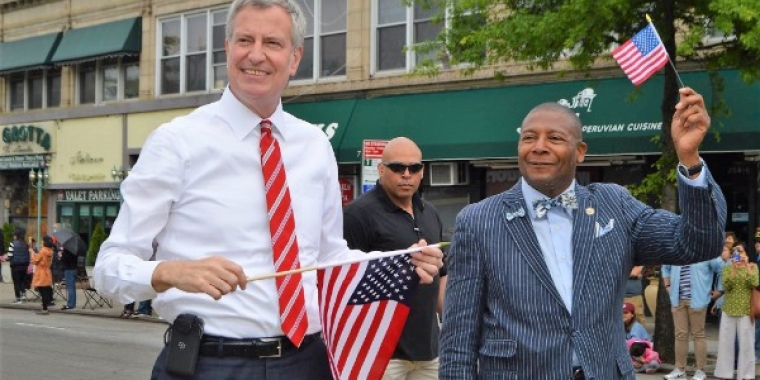 Senator James Sanders Jr. (D-Queens) marches with New York City Mayor Bill de Blasio at the Little Neck-Douglaston Memorial Day Parade.