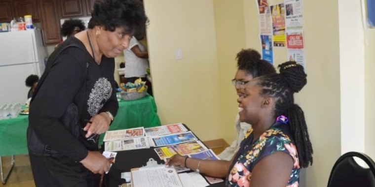 Team Sanders' member Zaleika Johnson, assists constituent Johneesa Harper, who had concerns about poor lighting near a local train stop. Also providing support at the event was Sanders' intern, Audrianna Brown.