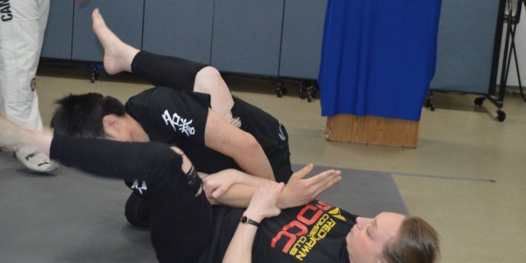 Members of the Red Dawn Combat Club demonstrate one of many ways to break free from and attacker.