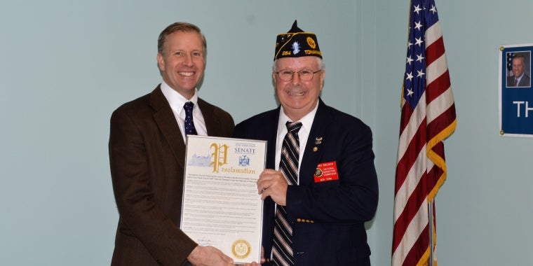 Senator Jacobs presenting a proclamation to December 2017 Veteran of the Month Dennis Smilinich