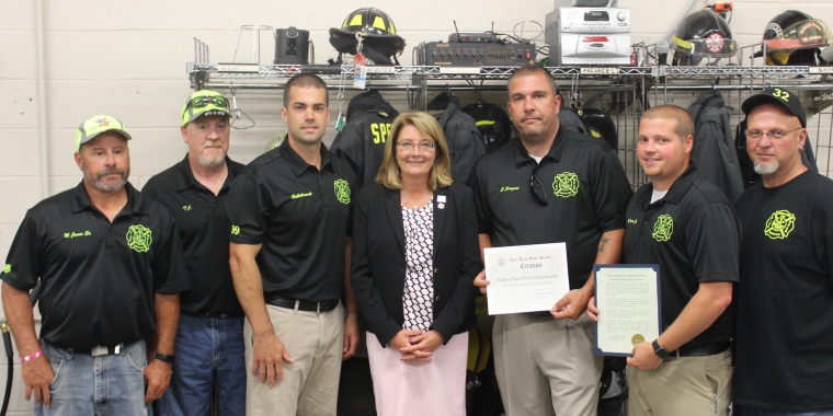 Senator Pam Helming stands with members of the Sodus Point Volunteer Fire Department.