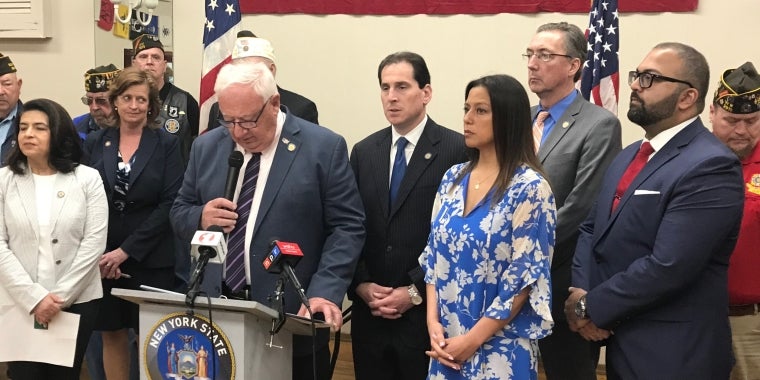 Left to Right - Senator Anna Kaplan, Assemblywoman Judith Griffin, Senator John Brooks (podium), Senator Todd Kaminsky, Senator Monica Martinez, Senator Jim Gaughran, Senator Kevin Thomas
