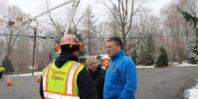 (R-L) Senator Terrence Murphy and Somers Supervisor Rick Morrissey are briefed on restoration efforts by a crew worker from Northline Utilities in Somers.