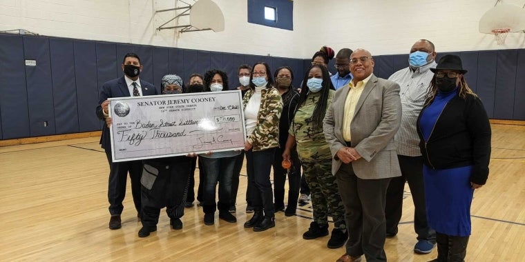 NYS Senator Cooney Presents Ceremonial Check to Baden Street Settlement Leadership & Staff