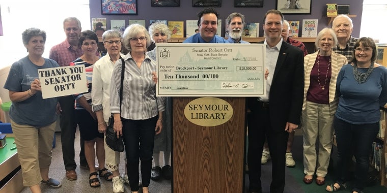 Sen. Rob Ortt presents $25,000 to three Monroe education facilities.