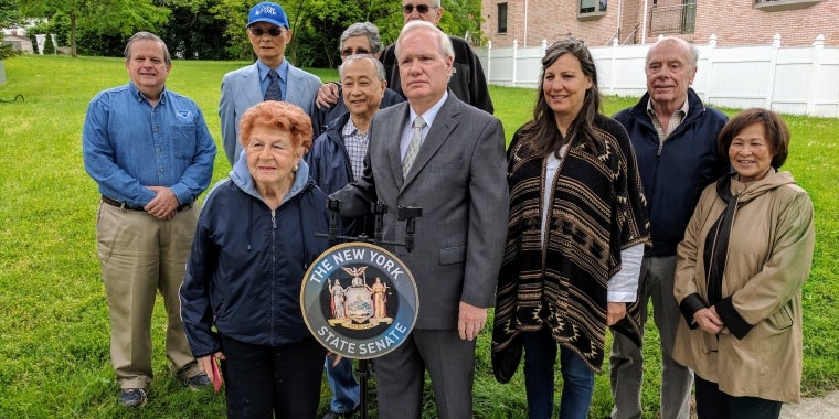 Senator Avella and Douglaston Residents Stand at 10,000 square foot vacant lot they want transformed into park