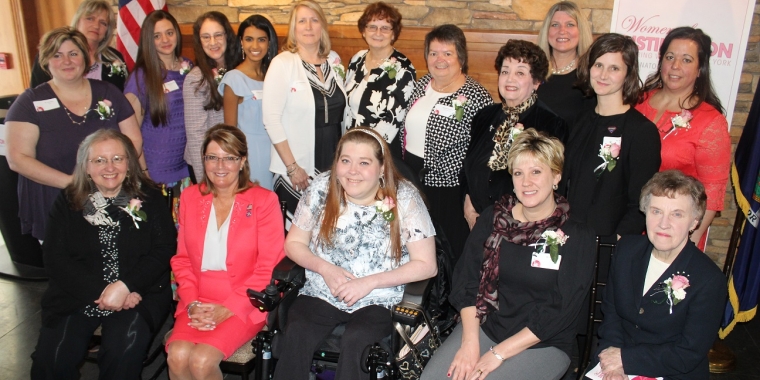 Senator Helming gathers with the 16 nominees for the New York State Senate Woman of Distinction award from the 54th District. Sitting, from left, are: Oksana Fuller, of Canandaigua; Senator Helming; Michelle Fridley, of Canandaigua; Connie Patti, of Union Springs; and Patricia White, of Scipio Center. Standing, from left, are: Tricia Kuntz, of Palmyra; Cheri Roloson, of Williamson; Sarah Lynn Grossman, of Palmyra; Valerie Aarne Grossman, of Palmyra; Neetu Chandak, of Seneca Falls; Cathleen Bement, of Canandaigua; Ellen Hughes, of Waterloo; Laurie Crane, of Huron; Marie Milligan, of Geneva; Donna Besler, of Canandaigua; Lauren Moore, of Canandaigua; and Julie Bellone, of Waterloo.