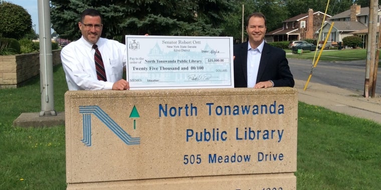 Sen. Rob Ortt (R,C,I,Ref-North Tonawanda) presents $25,000 to the North Tonawanda Public Library for use toward new public computers (L-R: Kevin Wall, Director of the North Tonawanda Public Library Director, Sen. Rob Ortt).