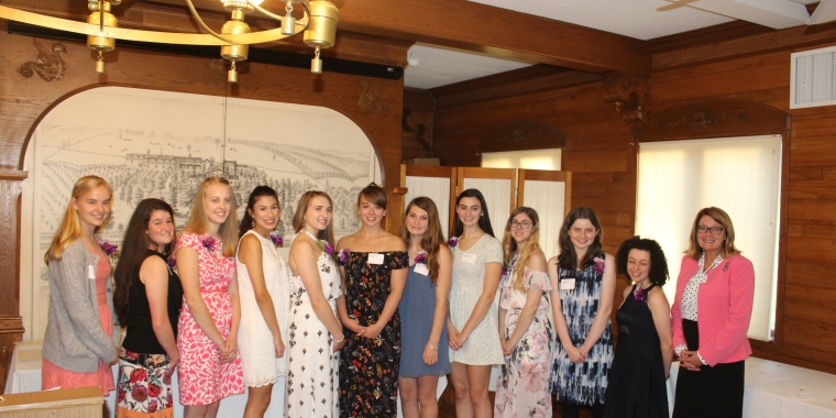 Senator Pam Helming stands with 11 recipients of the Professional Women of the Finger Lakes Scholarship Awards during a ceremony at the Canandaigua Yacht Club on Wednesday, May 23.