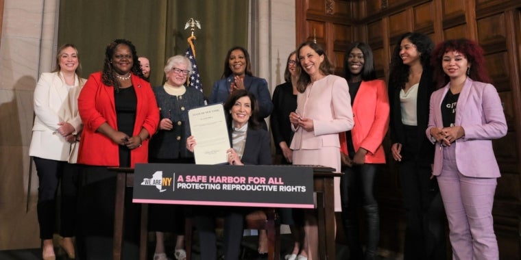 Senator Toby Ann Stavisky joins colleagues and advocates as Governor Kathy Hochul signs legislation to protect reproductive rights.