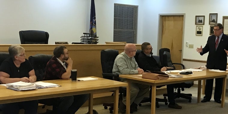 Senator James L. Seward addresses the Hartwick Town Board while announcing a $1 million state grant to fund major upgrades to the town’s water system. From left, Janice Gage, Quinton Hasak, Supervisor Robert O'Brien, Chris Briggs, Senator Seward.