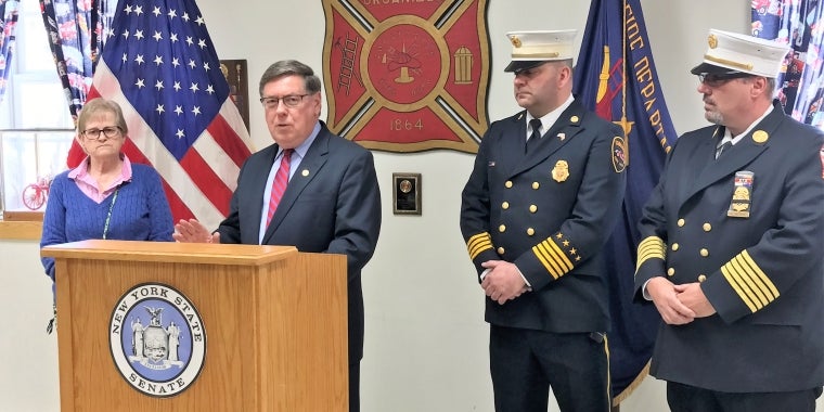 Senator James L. Seward holds a press conference at the Village of Cobleskill Fire Department to announce state grants of $100,000 for the Village of Cobleskill and $120,000 for Schoharie County.  From left, Village of Cobleskill Mayor Linda Holmes, Senator Seward, Cobleskill Village Fire Department Chief Rick Albert, President of the Schoharie County Fire Chiefs Association Bill Bivona.