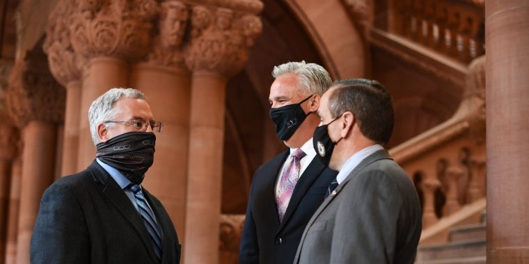 Senator Stec (from left) talks with Assembly members Simpson and Smullen in the State Capitol.