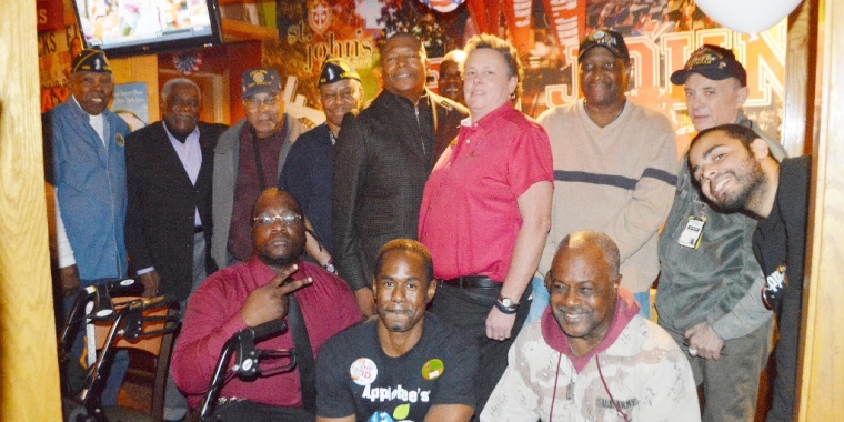 Senator Sanders poses for a photo surrounded by veterans, some of them community leaders, and the staff of the Applebee's at Five Towns, where he held his Annual Veteran's Day luncheon.