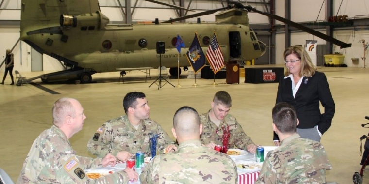 Senator Pam Helming speaking with a group of soldiers who recently returned home from their deployment in Afghanistan