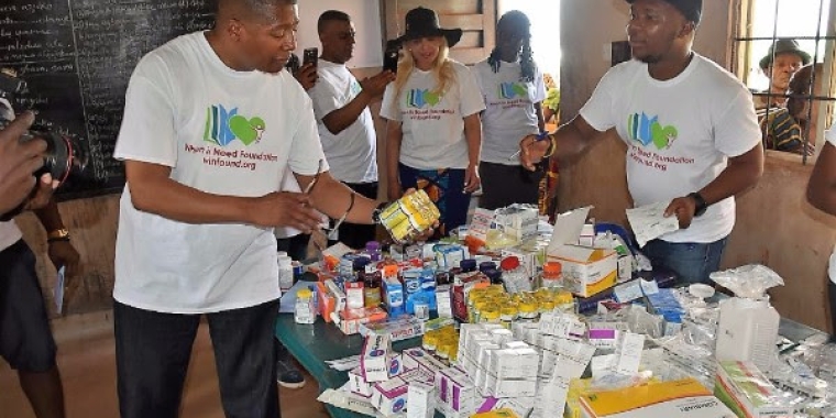 Sanders joined the When in Need Foundation in distributing medicines in Nigeria.