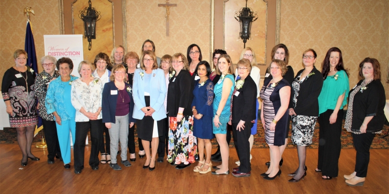 Senator Pam Helming stands with the 25 women from across the region who were nominated for New York State Senate Women of Distinction during a ceremony at Ventosa Vineyards in Fayette.