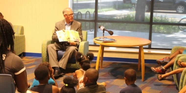 Senator Ranzenhofer reads books to children in the Accelerated Reading Room.