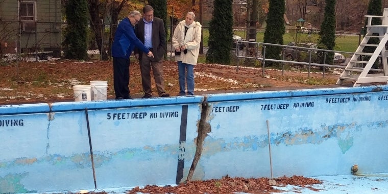 Senator Seward (center) surveys damage at the Village of Fleischmanns pool after announcing a $135,000 state grant to fund repairs.  From left, Mayor Donald Kearney, Senator Seward, Deputy Mayor Harriet Grossman.