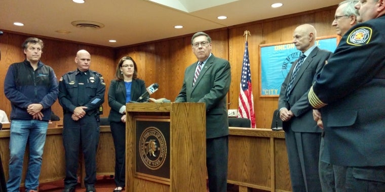 :  Senator Seward is joined by City of Oneonta officials to discuss his “SUNY Impact Aid Bill” that would provide mandate relief for SUNY host communities.  Standing behind Senator Seward from left, Otsego County District 12 Representative Craig Gelbsman, City of Oneonta Police Lieutenant Douglas Brenner, City of Oneonta Acting City Manager Meg Hungerford, City of Oneonta Mayor Gary Herzig, City of Oneonta Second Ward Alderman Larry Malone, City of Oneonta Fire Chief Patrick Pidgeon.
