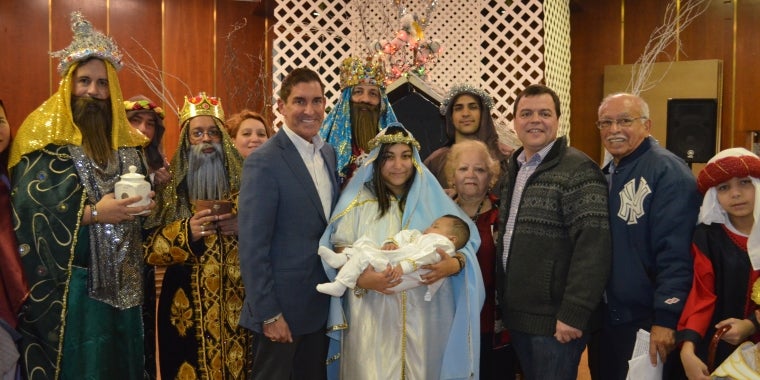 Photo caption: (left to right): Senator Jeff Klein, Assemblyman Luis Sepulveda, and District Leader Julia Rodriguez are joined by the Holy Family Choir and nativity performers as they celebrate Three Kings Day.