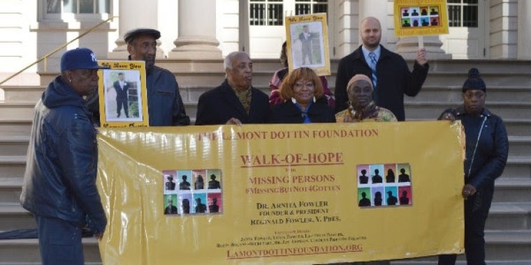 Elected officials and missing persons advocates mark the enactment of important legislation with a press conference at City Hall. They include Assembly Member Charles Barron (third from left), Dr. Arnita Fowler, center, and Council Member Inez Barron.