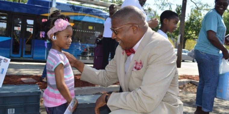 Senator Sanders greets Kaysha Bonnaire of Jamaica who was all ready to claim her school supplies.