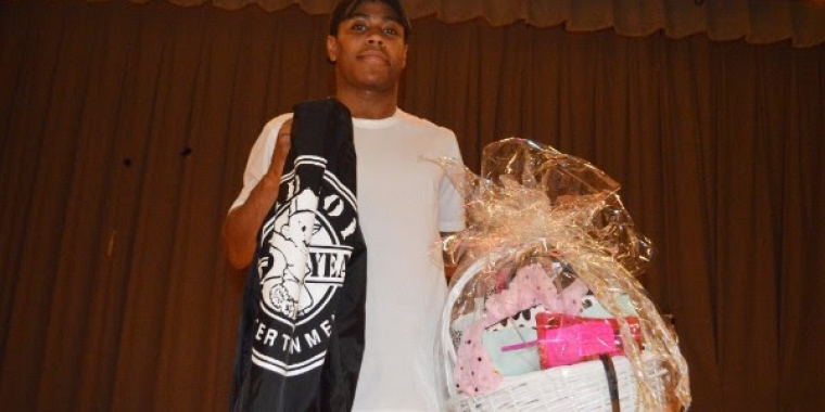 Winner David Volcy shows off his prizes - a jacket from Bad Boy Entertainment and a gift basket from Steve Madden.
